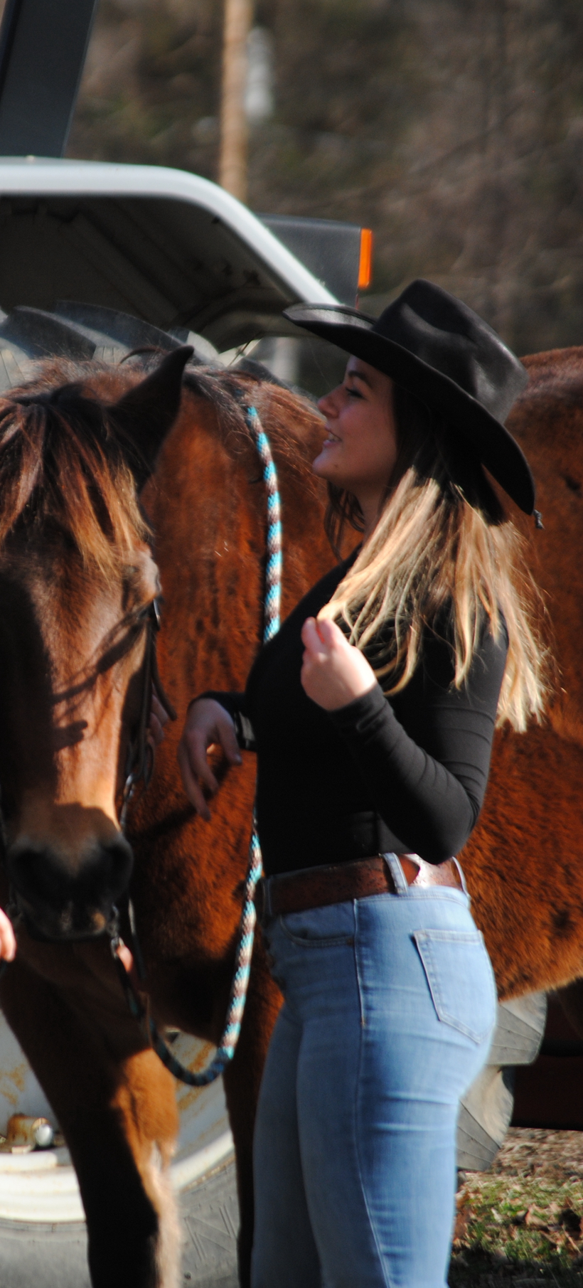 Instructor in profile with her horse